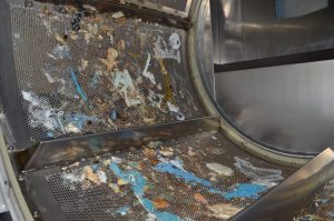 An un-coated dryer panel with melted plastic. DECC’s coating helps eliminate this problem.