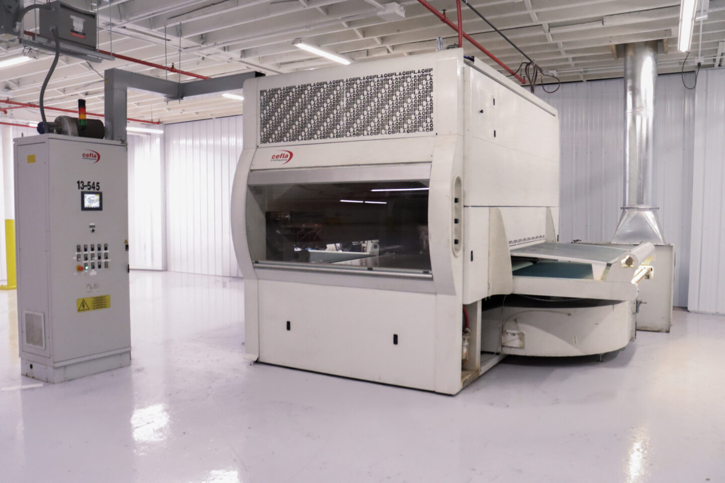 DECC Company flatline spray coating system used mainly for dielectric coatings.