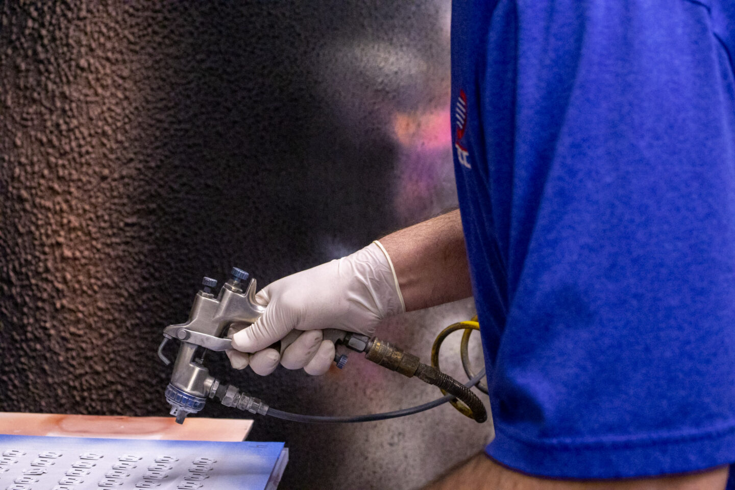 DECC Spray gun specialist coating parts manually with dielectric coating.