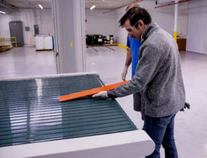 Engineer testing different dielectric coatings on the flatline spray system to ensure proper coating application.