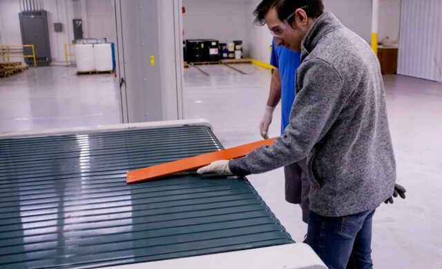 Engineer testing different dielectric coatings on the flatline spray system to ensure proper coating application.