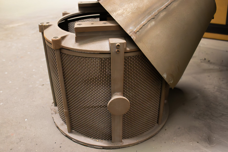 DECC's dip-spin wire basket to put parts in and lower into the coating.